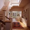 This is view from entry looking past new stair to solarium and backyard.  There are skylights in stairwell that bring light and ventilation into the center of the house. 