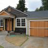 Original siding could not be salvaged, and was replaced with Hardie Artisan Plank. New doors and windows made quite an impact.  Only addition was new porch.