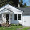 Exterior shows consistent use of colonial revival details to develop Cape Cod  theme.  It has a classic all white exterior with Essex green sash and entry door.