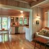 This is view from family room  into kitchen with covered porch beyond French doors.