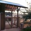 Tall roof of workshop was extended to become a ceramonial portal for campers entering the garden.  