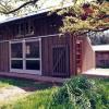 Barn doors open workshop to garden.  Campers use this building for their projects.